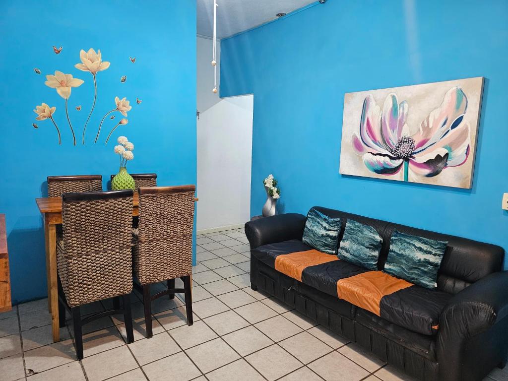 a living room with a couch and a table at LOS SAUCES STUDIO in Puerto Vallarta