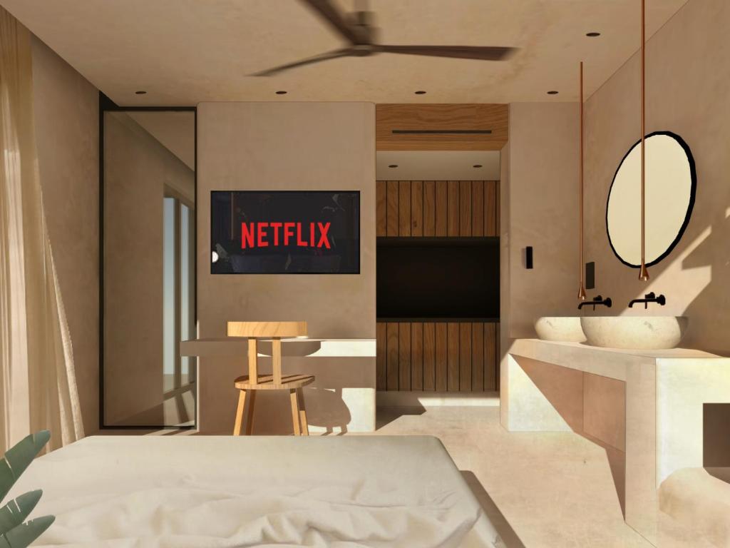 Postel nebo postele na pokoji v ubytování Portiani Suites
