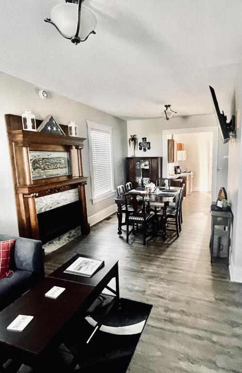a living room with a table and a dining room at Werner Haus in Sandusky