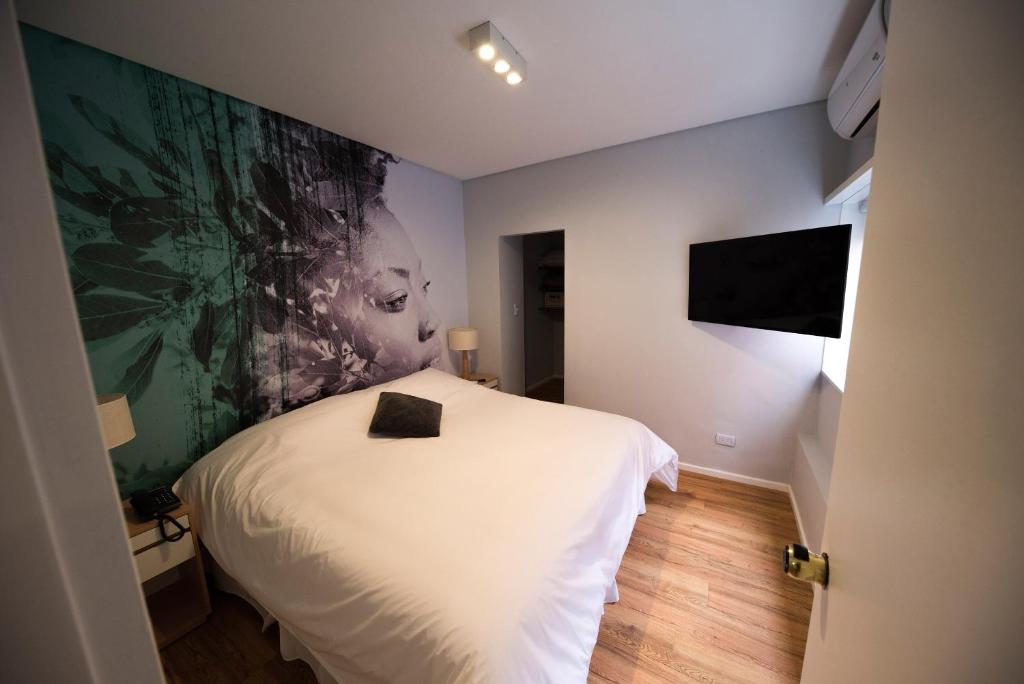 Una cama o camas en una habitación de Alquileres Temporarios by CLH Rentals