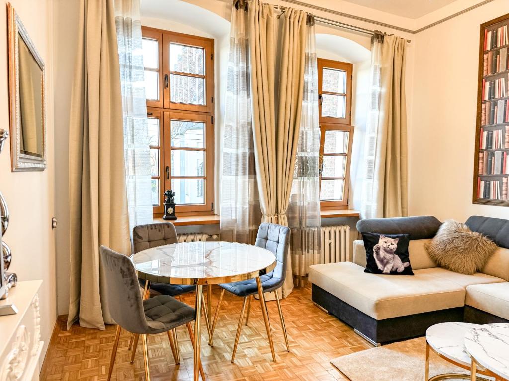 a living room with a couch and a table at Luxury Decor & Amazing Island Views, Center! 5mins Rynek in Wrocław