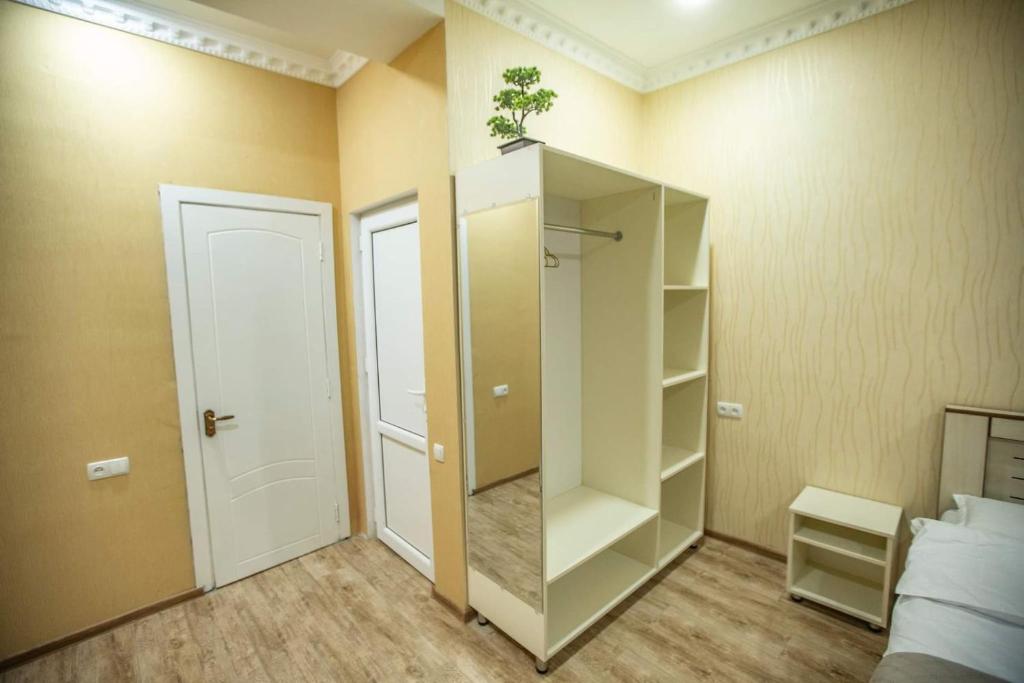 Postel nebo postele na pokoji v ubytování Tbilisi Town