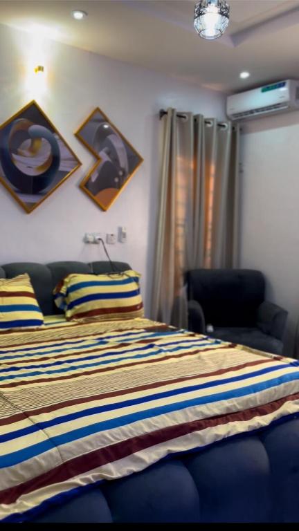 Postel nebo postele na pokoji v ubytování Sea-Love Apartment In Ado-Ekiti