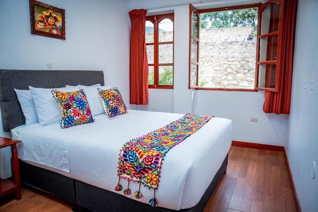Postel nebo postele na pokoji v ubytování Valle Mistico Hotel Boutique