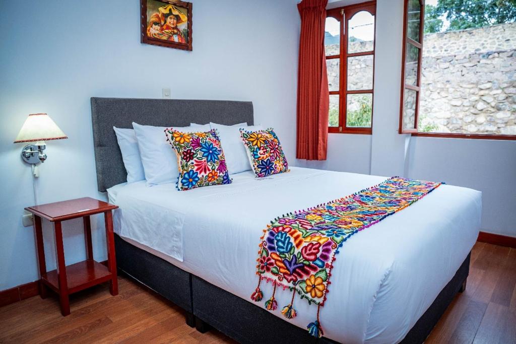 Postel nebo postele na pokoji v ubytování Valle Mistico Hotel Boutique