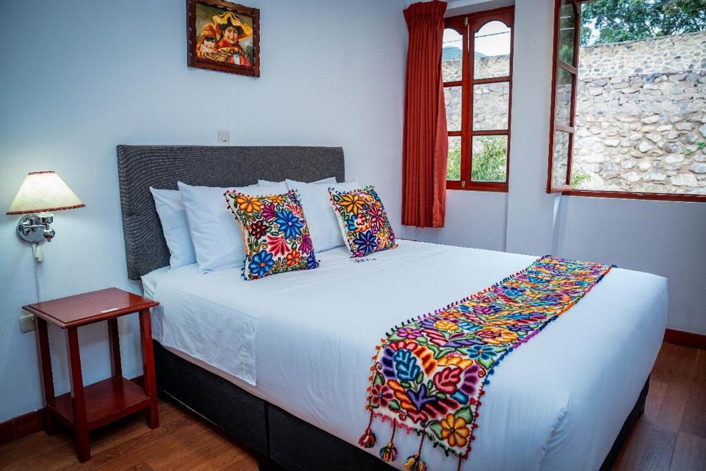 Postel nebo postele na pokoji v ubytování Valle Mistico Hotel Boutique