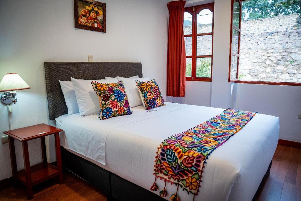 Postel nebo postele na pokoji v ubytování Valle Mistico Hotel Boutique