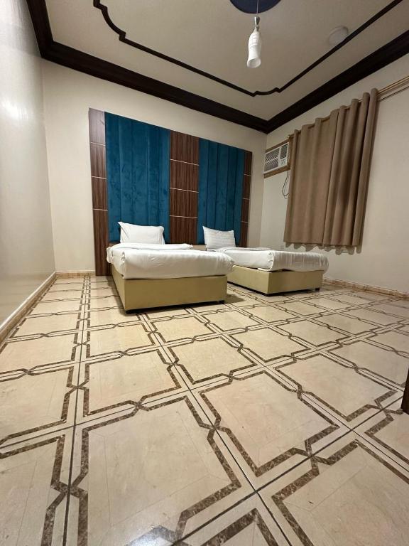 Postel nebo postele na pokoji v ubytování كــيــان الـمـنـسـك Kayan Al Mansak