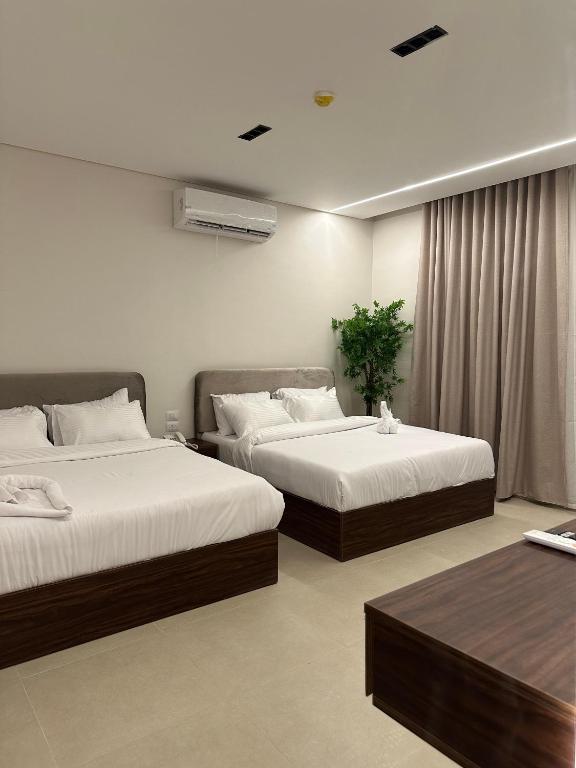 Postel nebo postele na pokoji v ubytování Imperial Hotel