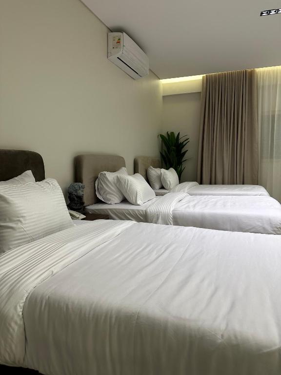 Postel nebo postele na pokoji v ubytování Imperial Hotel