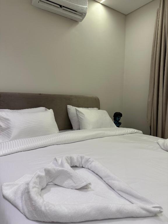 Postel nebo postele na pokoji v ubytování Imperial Hotel