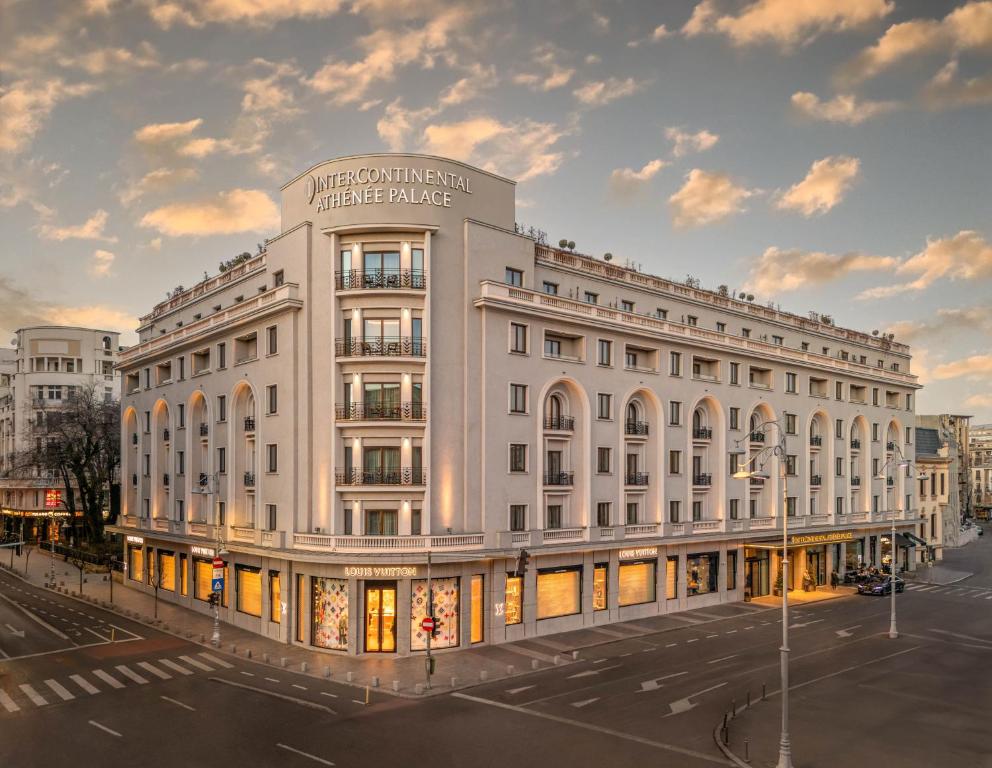 a large white building with a sign on it at InterContinental Athenee Palace Bucharest by IHG in Bucharest