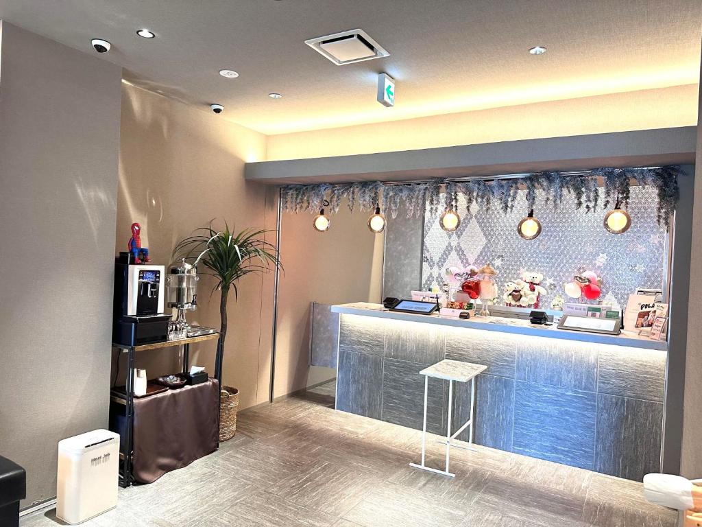 TV a/nebo společenská místnost v ubytování Dynasty Hotel & Resort Osaka