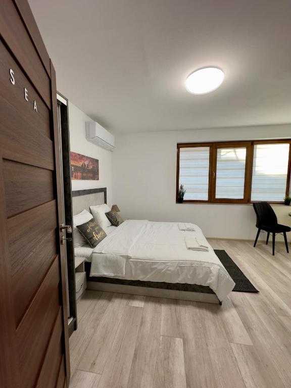 a bedroom with a bed and a sliding door at Sea in Varna City