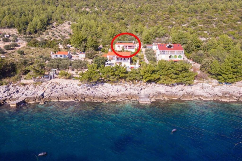 an aerial view of a house on a island in the water at House Ivana in Blato