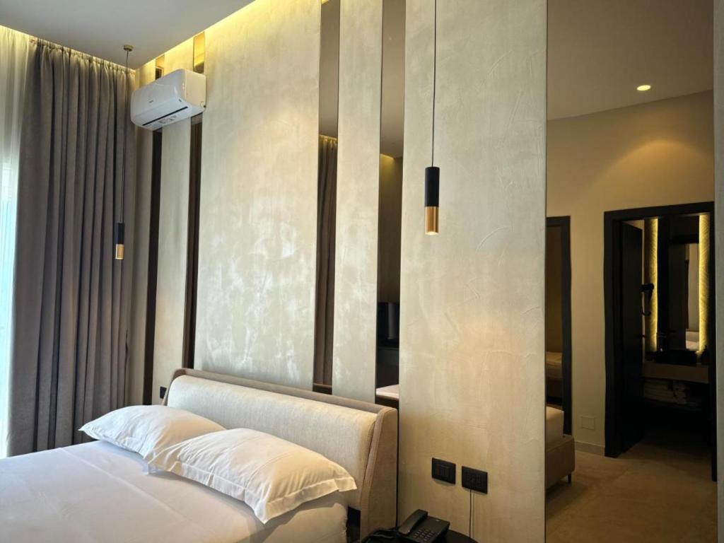 Postel nebo postele na pokoji v ubytování Nuna Hotel & Apartments