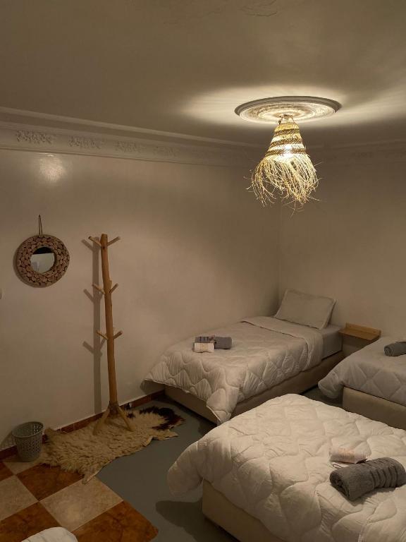 Postel nebo postele na pokoji v ubytování Titryte Surf House