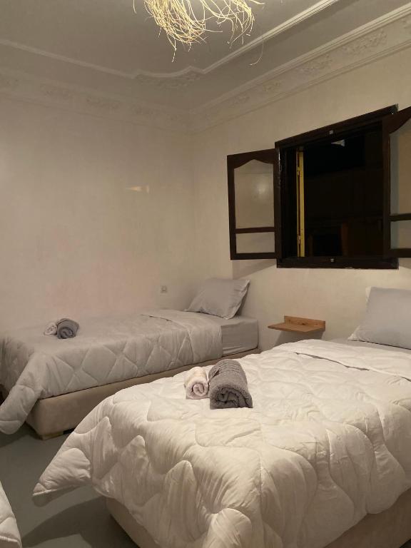 Postel nebo postele na pokoji v ubytování Titryte Surf House