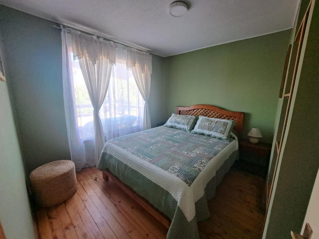 Postel nebo postele na pokoji v ubytování Cabañas Puerto Ensenada