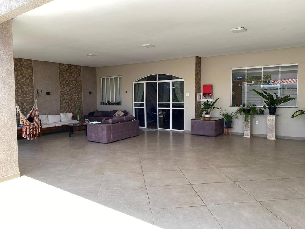a large living room with a couch and a table at Casa à 700m da Praia de Atalaia! in Aracaju