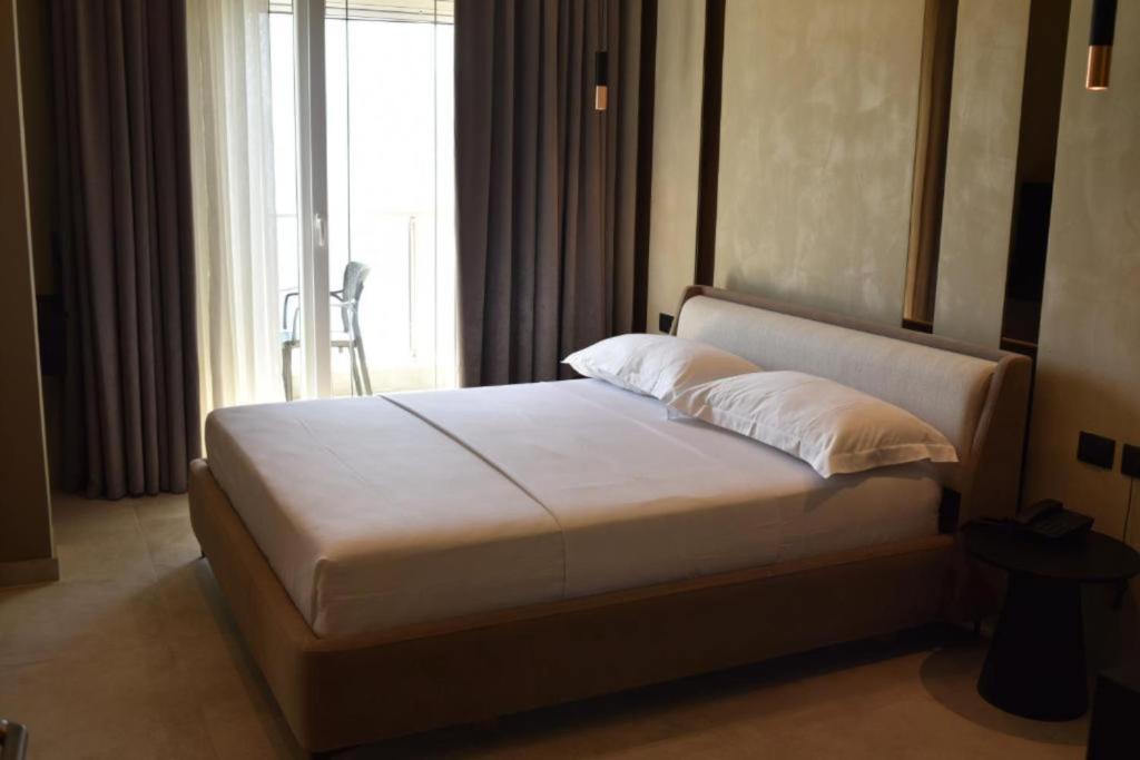 Postel nebo postele na pokoji v ubytování Nuna Hotel & Apartments