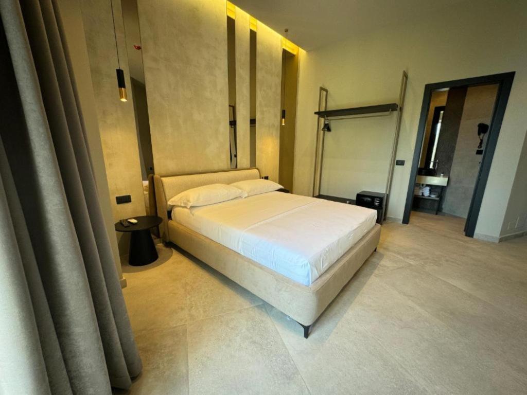 Postel nebo postele na pokoji v ubytování Nuna Hotel & Apartments