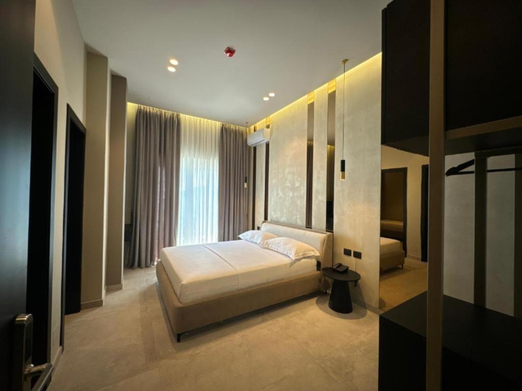 Postel nebo postele na pokoji v ubytování Nuna Hotel & Apartments