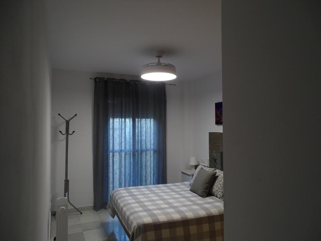 Łóżko lub łóżka w pokoju w obiekcie Apartamento Oropendola 9