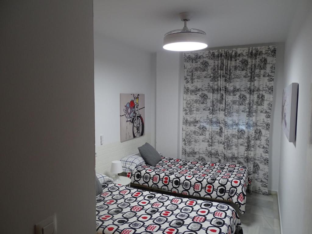 Łóżko lub łóżka w pokoju w obiekcie Apartamento Oropendola 9