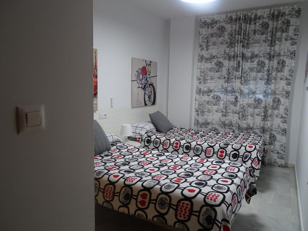 Łóżko lub łóżka w pokoju w obiekcie Apartamento Oropendola 9