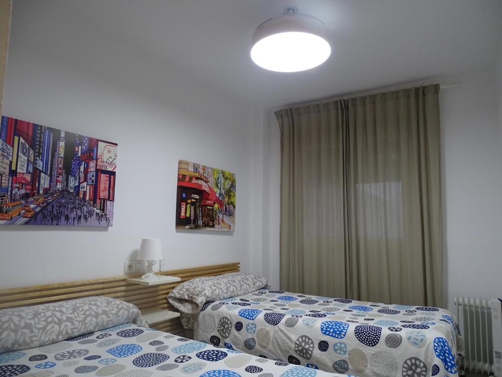 Łóżko lub łóżka w pokoju w obiekcie Apartamento Oropendola 9