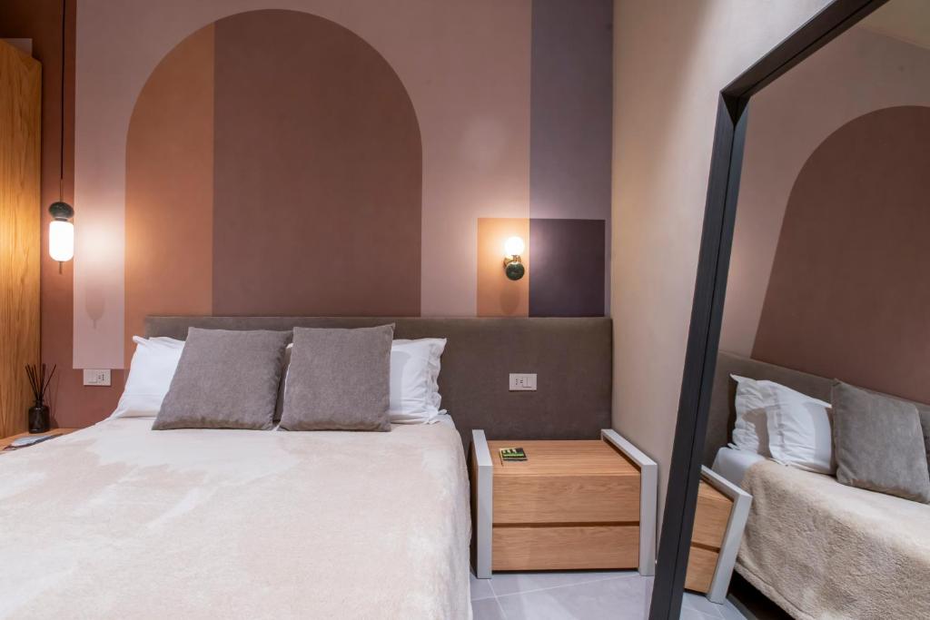 Postel nebo postele na pokoji v ubytování Locanda Expanificio