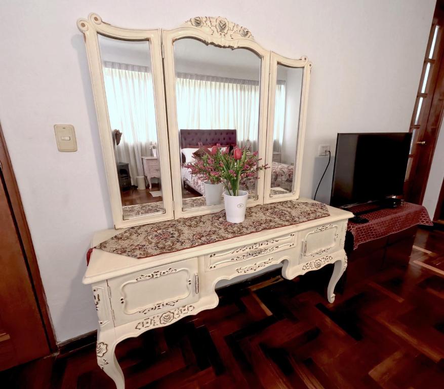 TV a/nebo společenská místnost v ubytování Residencial Belle Maison