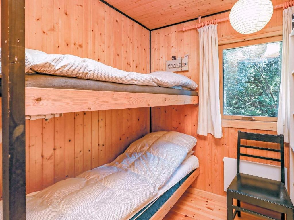 Postel nebo postele na pokoji v ubytování Three-Bedroom Holiday home in Blokhus 21