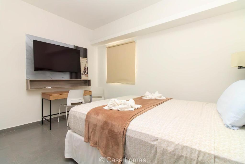 Postel nebo postele na pokoji v ubytování Casa Lomas