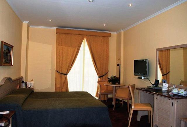 Una cama o camas en una habitación de Hotel Giardino Inglese