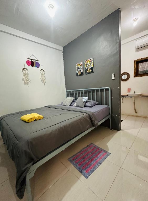 Postel nebo postele na pokoji v ubytování D'Flora Homestay