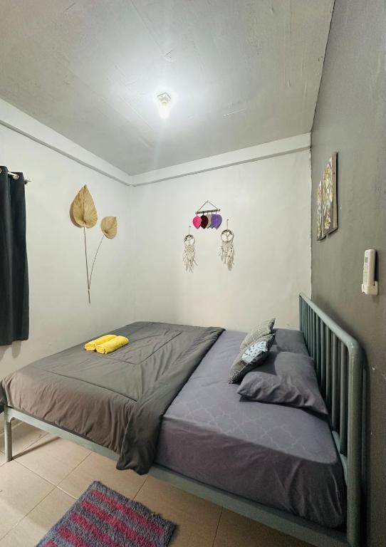 Postel nebo postele na pokoji v ubytování D'Flora Homestay