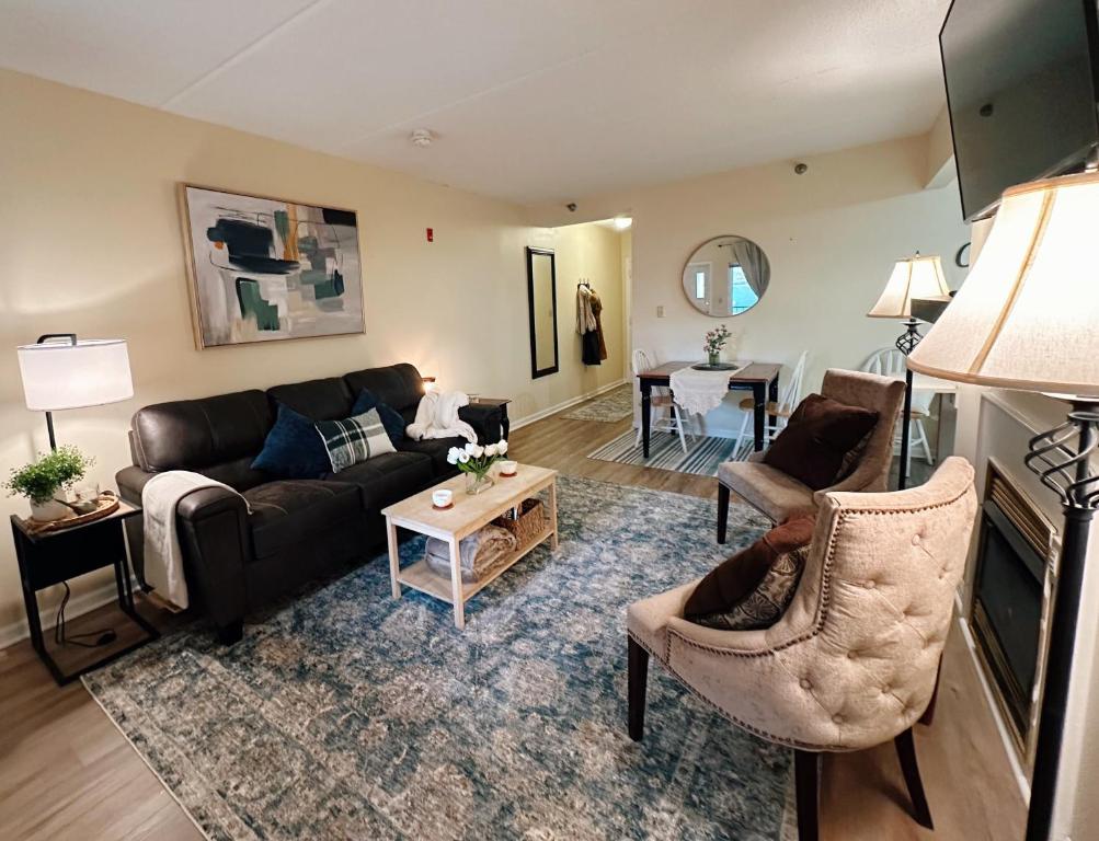 a living room with a couch and a table at Smoky Hue in Gatlinburg