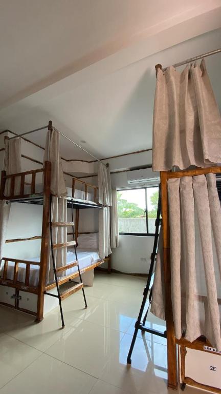 Voodi või voodid majutusasutuse The Hat Trick Hostel toas