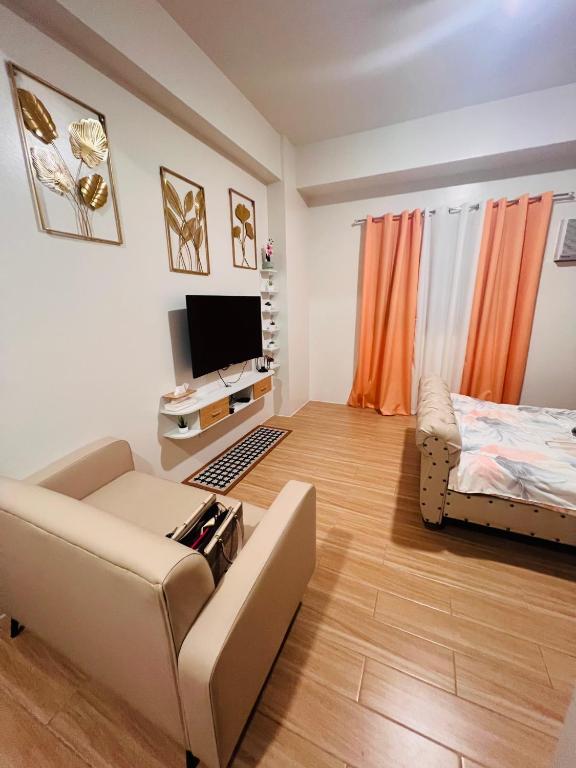 TV a/nebo společenská místnost v ubytování Tulip Garden Condominium Southwoods
