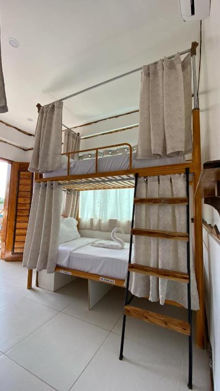 Voodi või voodid majutusasutuse The Hat Trick Hostel toas