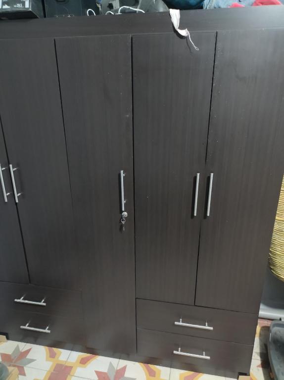 a pair of black cabinets with silver handles at Bruma in Papalotla