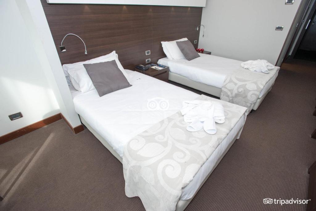 Postel nebo postele na pokoji v ubytování Hotel Selene Pomezia