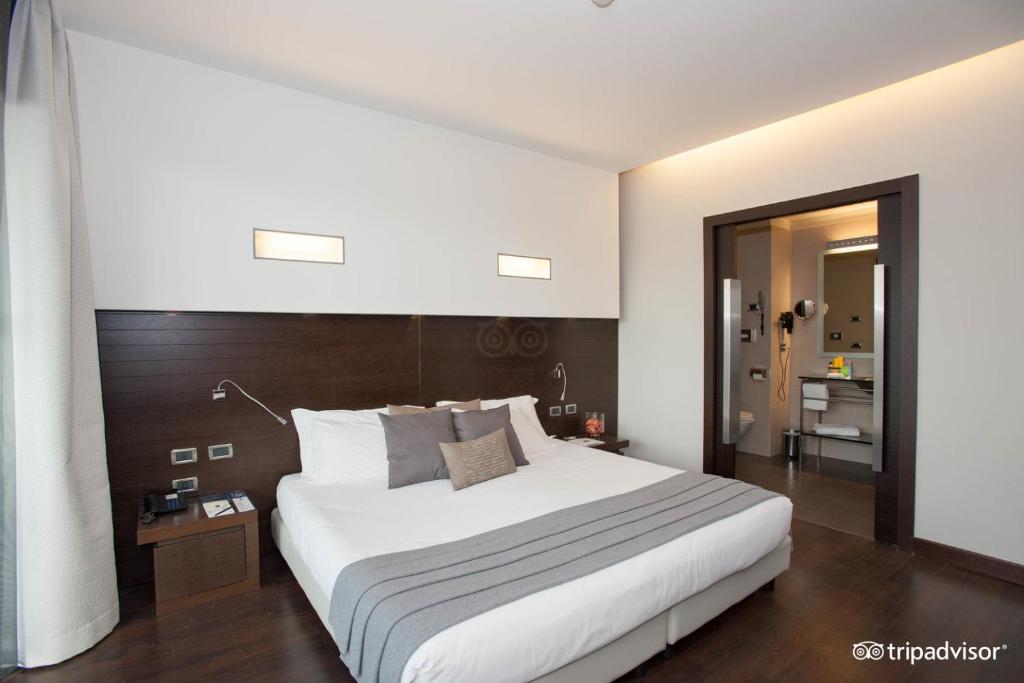 Postel nebo postele na pokoji v ubytování Hotel Selene Pomezia