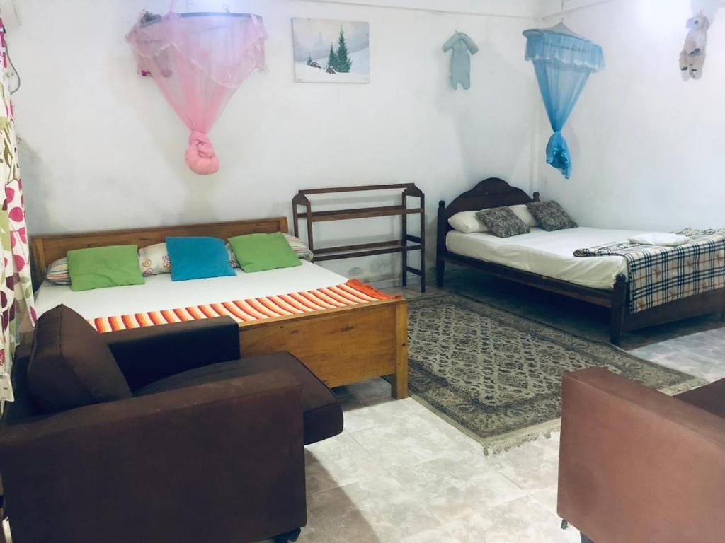 Postel nebo postele na pokoji v ubytování Thisara Pool Hotel Kataragama & Yala-Kabiliththa Safari