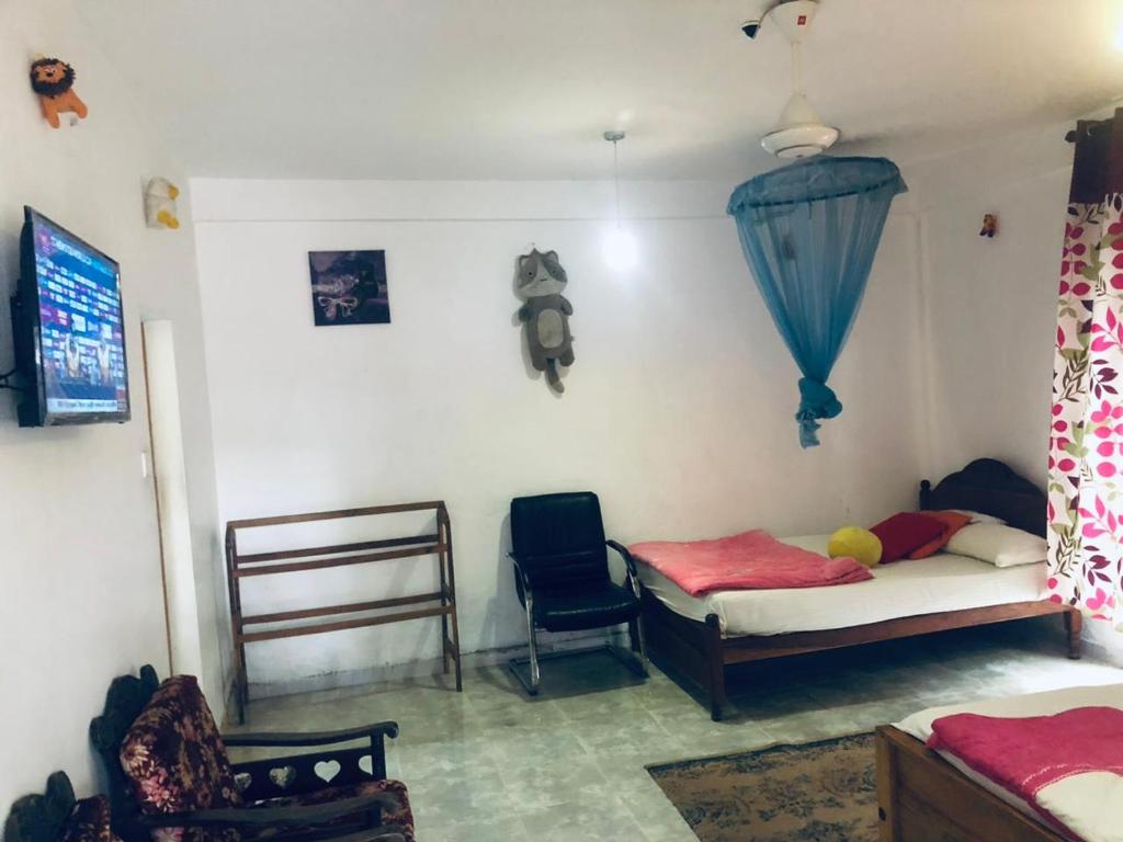 Postel nebo postele na pokoji v ubytování Thisara Pool Hotel Kataragama & Yala-Kabiliththa Safari
