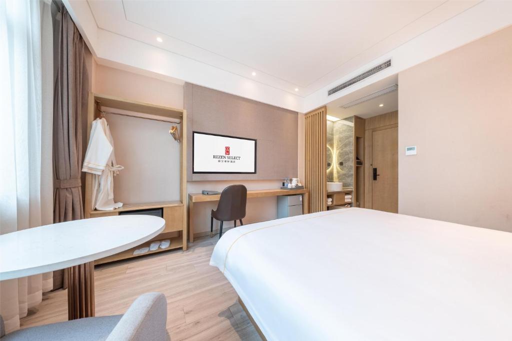 Postel nebo postele na pokoji v ubytování Rezen Select Shanghai International Resort