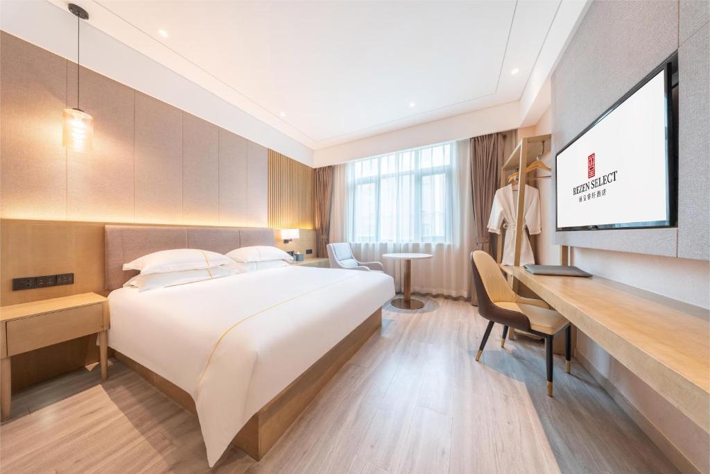 Postel nebo postele na pokoji v ubytování Rezen Select Shanghai International Resort