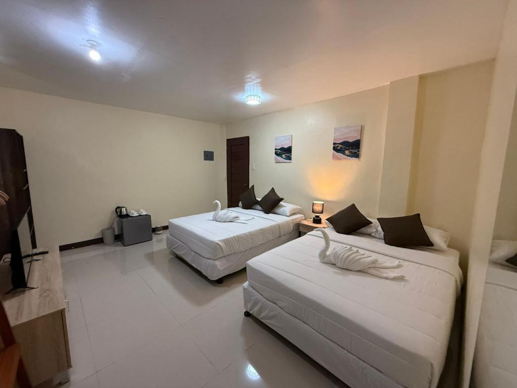 Postel nebo postele na pokoji v ubytování D-Travelers Inn